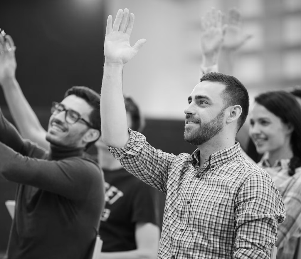 Group session — people raising their hands